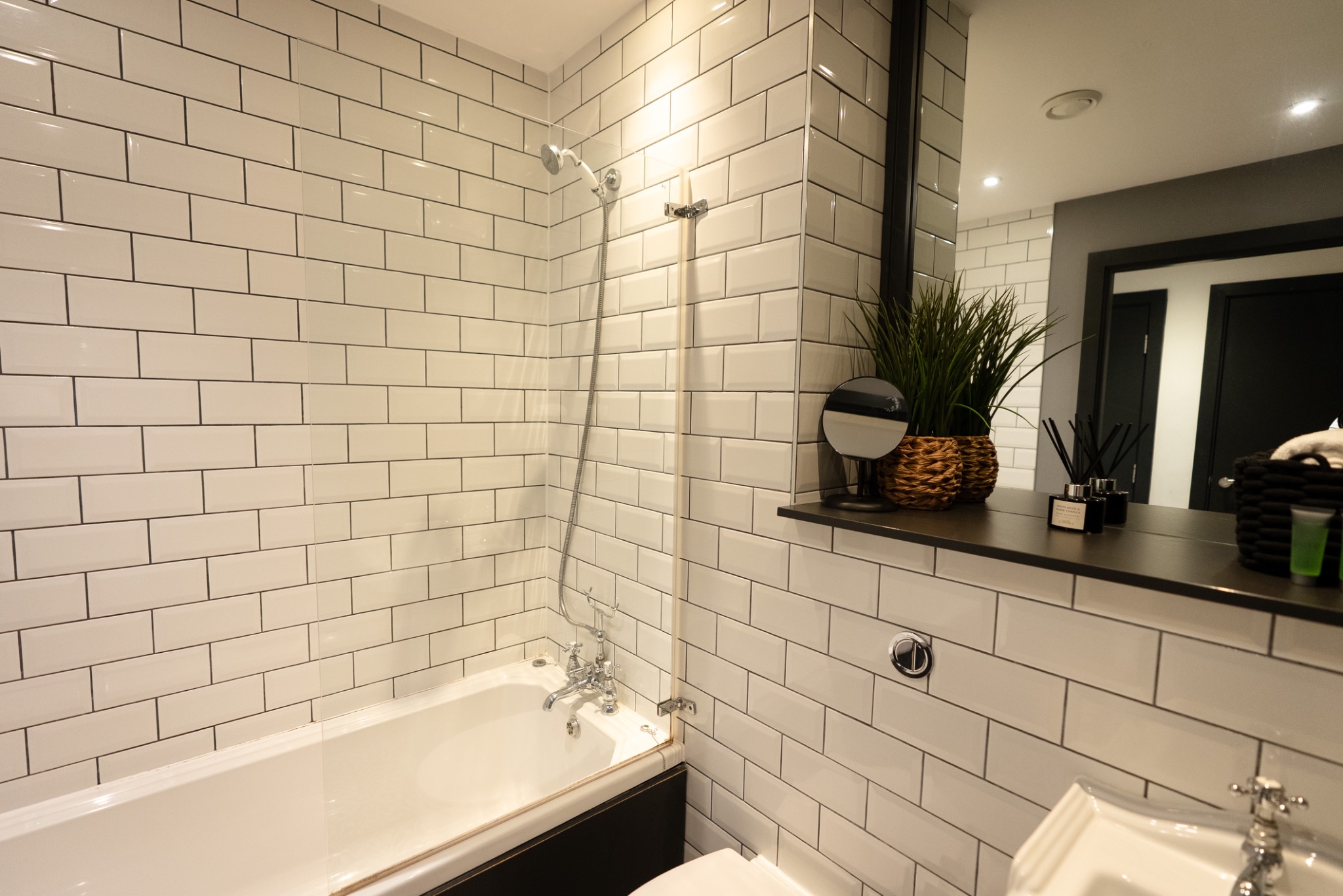 Bathroom with bath and shower