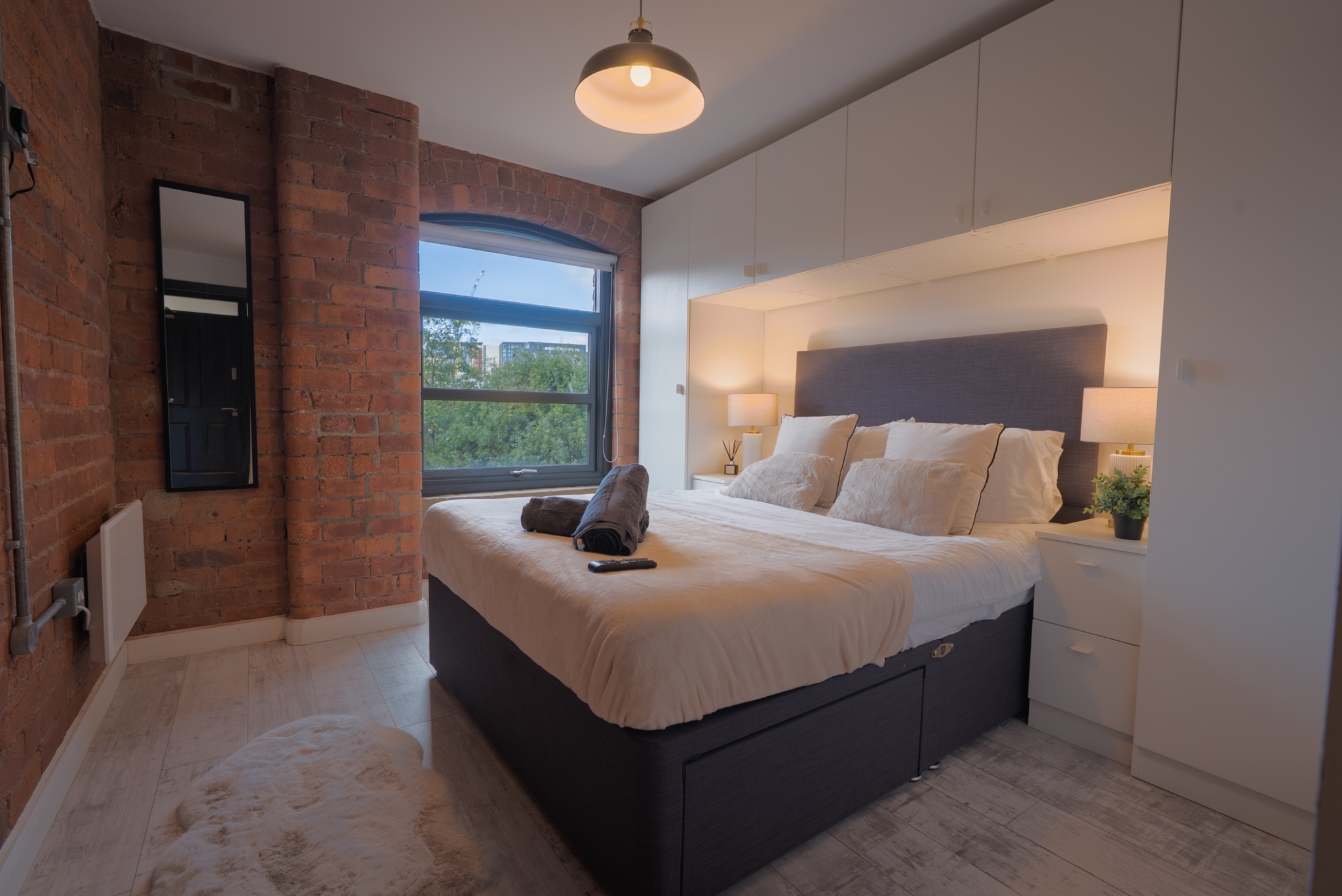 Bedroom with double bed and built-in storage